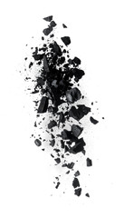 Activated charcoal powder splash or explosion flying in the air isolated on white background