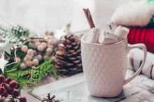 Christmas Decor: Warm Sweater, Cup Of Hot Cocoa With Marshmallow, Candy, Candles And Christmas Tree. Winter Mood, Decoration.