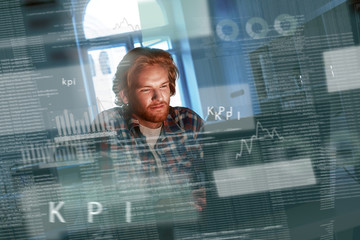 young concentrated computer developer writing new code
