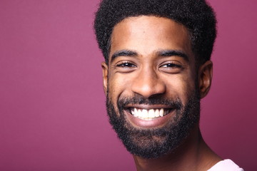 Wall Mural - Beautiful black man in front of a colored background