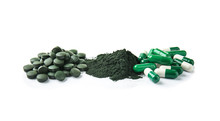 Spirulina Tablets With Powder And Capsules On White Background