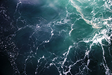 ocean view from the top. blue-green waves, storm, sea surface.