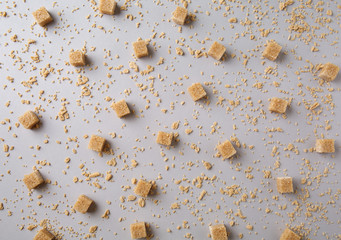 brown cubes with maple sugar flakes on grey background