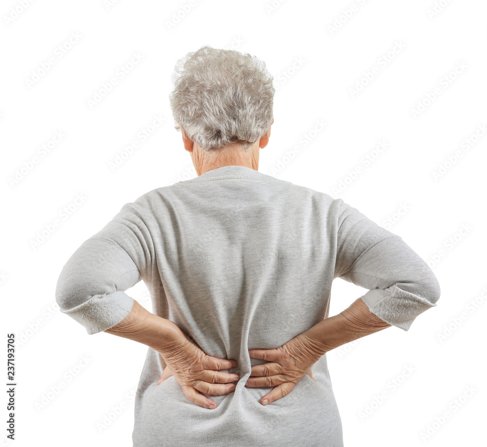 Senior woman suffering from back pain on white background
