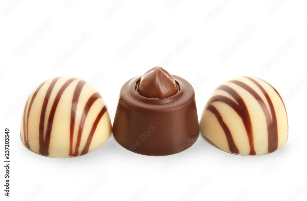 Different tasty chocolate candies  on white background