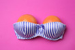 © Pixel-Shot - Ripe grapefruits in bra on color background