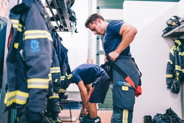 Wall Mural - Firemen preparing for emergency service.