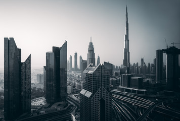 Wall Mural - Dubai skyline in the morning, aerial top view to downtown city center landmarks at sunrise. Famous viewpoint, United Arab Emirates