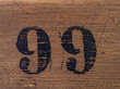 Number 99 on wooden surface