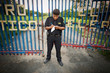© Erickson Stock - View of a security guard near a gate.