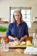 © Trinette Reed/Stocksy - Mature woman making her own natural cleaning products at home