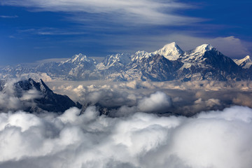 Wall Mural - Minya Konka (Mount Gongga) view from Niubeishan Cattle Back Mountain in Sichuan Province, China. Summit shrouded in clouds. Highest Mountain in Sichuan Province China. Hard Rime, deep snow, frost