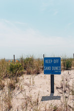 Sign With Keep Off Sand Dunes By A Beach