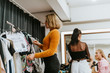 © Rawpixel.com - Stylist selecting clothes for a model
