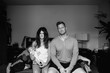 © Rob and Julia Campbell/Stocksy - Stressed and tired new parents with screaming newborn baby in be