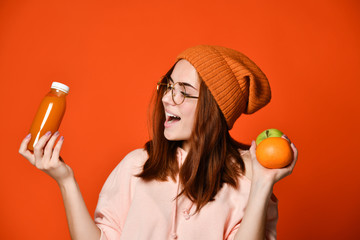 Fashion pretty young woman with fresh fruit juice