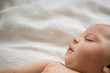 © jamie grill atlas/Stocksy - Close up of sleeping baby