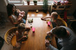© Rob and Julia Campbell/Stocksy - Real family dinner with stressed out mom, busy kids and normal food