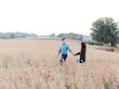 © Marta Locklear/Stocksy - Couple Embracing in a vast field