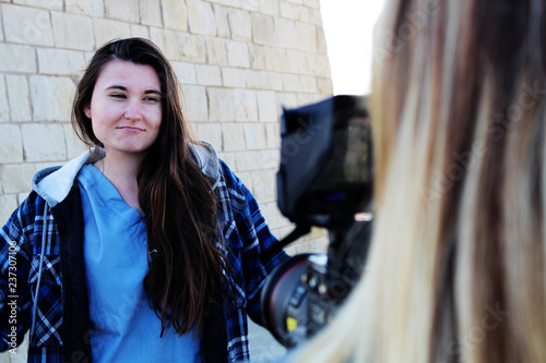 Fotografia, Obraz Actress smiling in front of camera behind the scenes