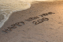 Happy New Year 2019,written In Sand Write On Tropical Beach With Wave