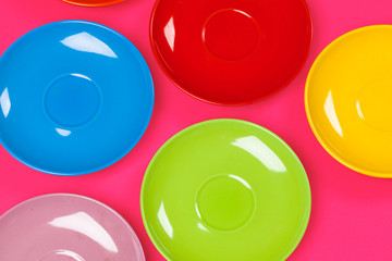 Colorful saucers on a vibrant bright background