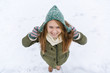 © AnastazjaSoroka - A young beautiful girl with long blond hair enjoys the first snow.