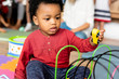 © Rawpixel.com - Little boy playing toys in the playroom
