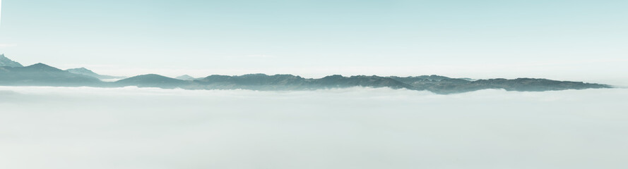 Leinwandbilder - panoramic view of swiss alps over clouds cover