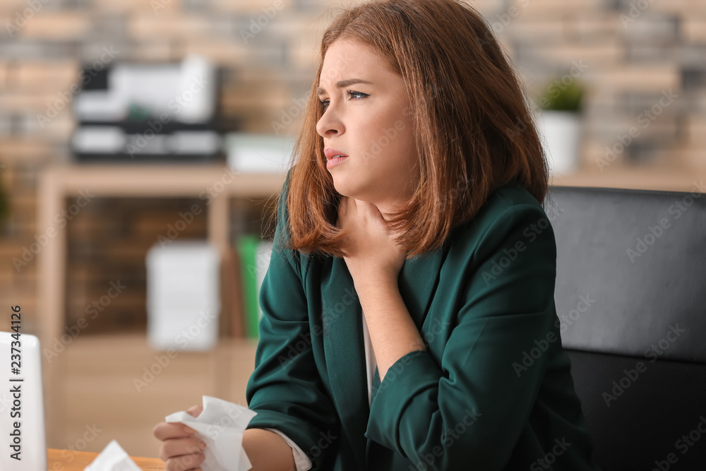 Young woman ill with flu in office