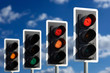 ROW OF FOUR ROAD TRAFFIC LIGHTS SHOWING SEQUENCE OF RED RED AND AMBER GREEN AND AMBER