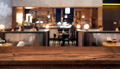 Wall Mural - Table top counter with blurred people and restaurant interior background