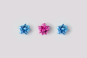 Wall Mural - minimal composition background of plastic pink and blue decorative christmas gift bows. new year con