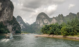 Fototapeta  - Cruise in the river Li between Guilin and Yangshuo. China. Landscape of Guilin, Li River and Karst mountains.
