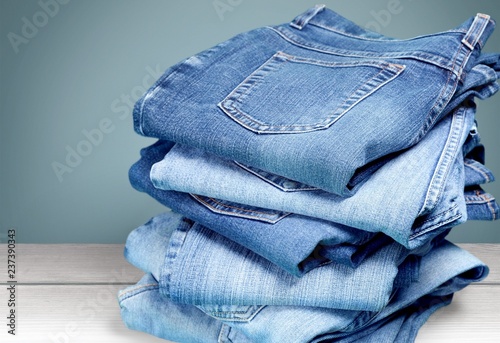 Fotografia Stack of jeans isolated on white background