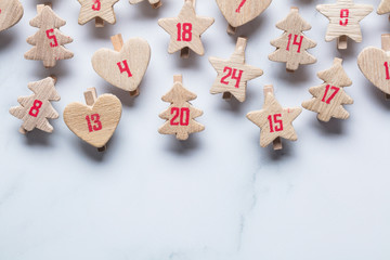 Wall Mural - Festive Christmas advent calendar made from wooden shapes