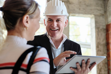 Woman Buying New Home And Talking To Broker