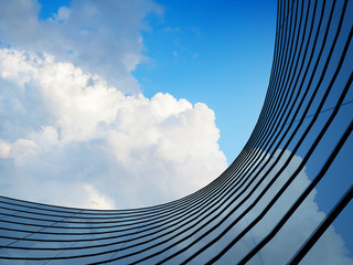 Aufkleber - Perspective of high rise building and dark steel window system with clouds reflected on the glass.Business concept of future architecture,lookup to the angle of the building corner. 3d rendering
