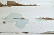 © MaxSafaniuk - Old shabby, breakaway white paint from the wooden structure in the apartment. Old paint layers