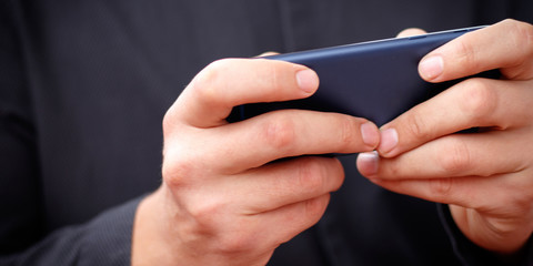 lifestyle young man using a mobile phone with texting message on app smartphone, playing social network and shopping online