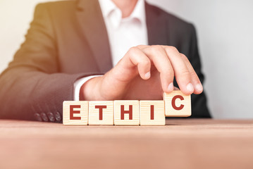 Poster - man made word ethic with wood blocks