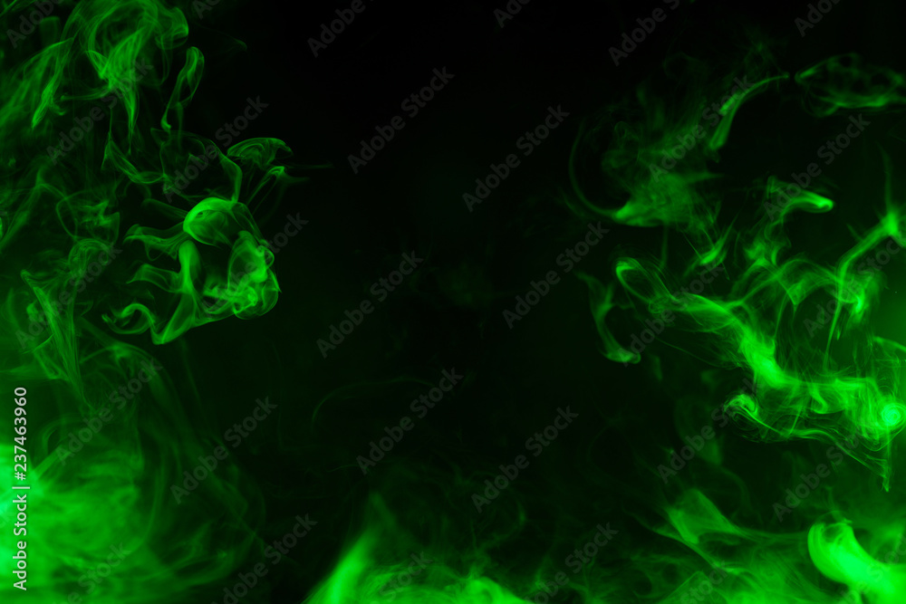 Photo Stock green smoke isolated on black background Adobe Stock
