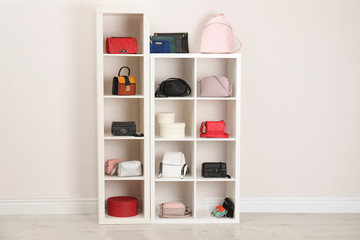 Sticker - Wardrobe shelves with different stylish bags indoors. Idea for interior design