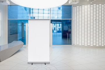 Canvas Print - Blank roll up banner stand in contemorary office interior