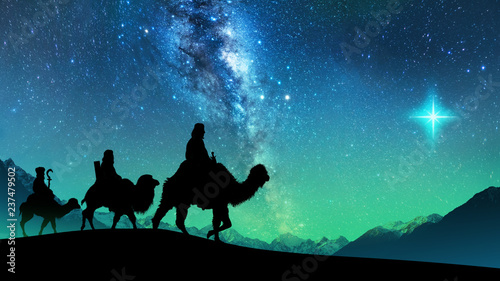 Cuadros en Lienzo Silhouette of Three wise men riding a camel along the star path