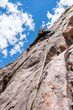 © abriendomundo - The last movements to reach the summit by a male climber. Rock climbing inside Andes mountains and valleys at Cajon del Maipo, an amazing place to enjoy rock climbing and mountaineering sports, Chile