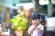 © Asada - cute Asian school girl in action of Thai greeting style. Thai greeting meaning is to say hello,welcome to other people and also thankful to other. In Thai language, it is called Sawatdee and wai.
