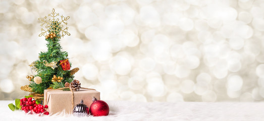 Aufkleber - Christmas tree and gift box at blur bokeh light background,Winter holiday banner greeting card.