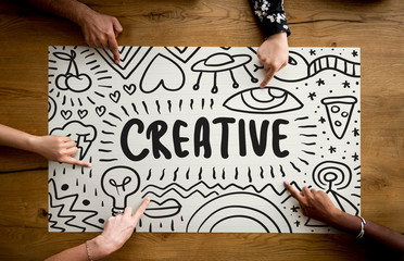 Wall Mural - fingers pointing at a creative idea typography