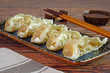 Dumpling : Chinese / Japanese dumplings, delicious traditional asian food. Japanese dumpling or Gyoza, Chinese dumpings or Jiaozi